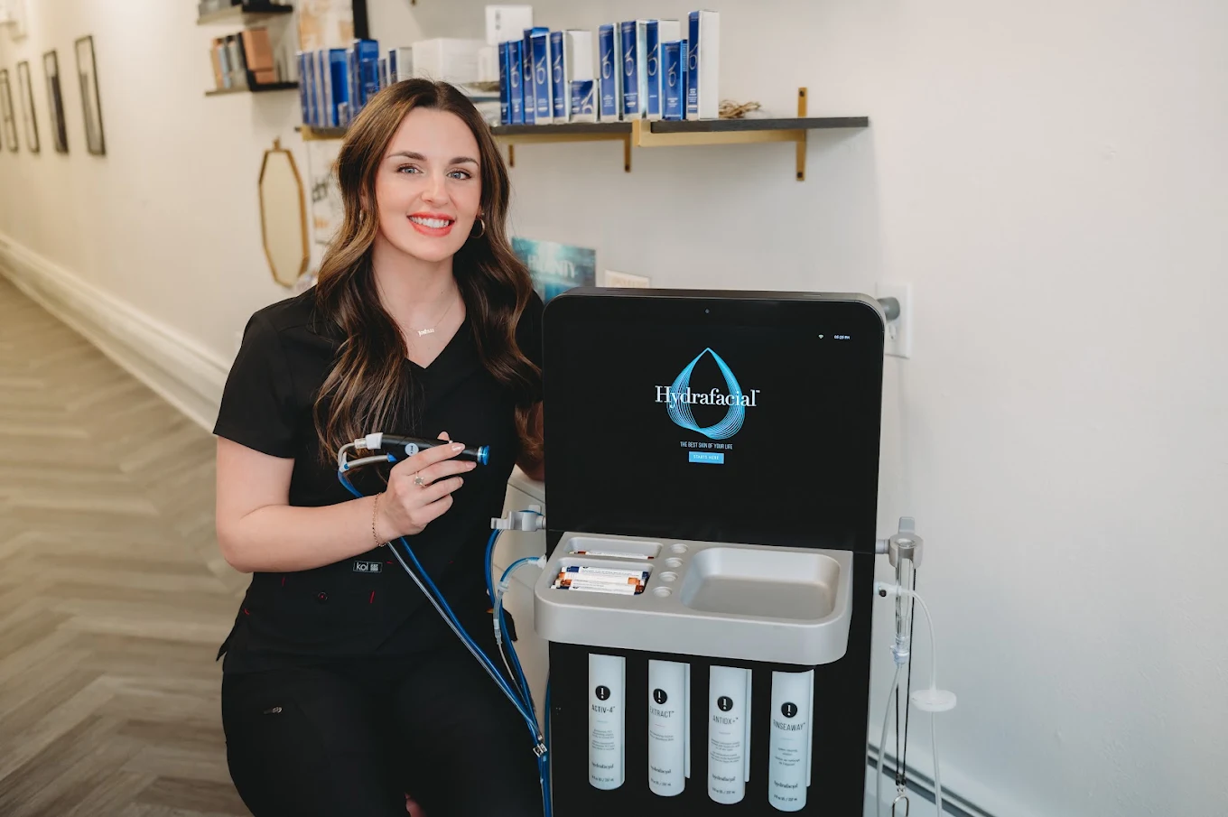 Prim Aesthetics team member with Hydrafacial equipment
